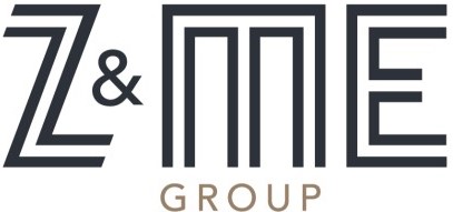 Logo of Z & ME Group featuring stylized letters "Z & ME" in dark gray and the word "GROUP" in smaller, gold-colored font below. The design uses geometric and modern typography.
